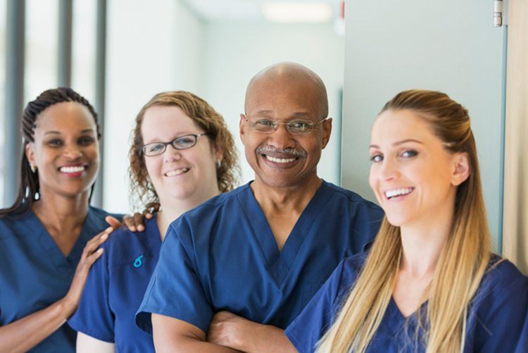 A group of four, diverse nurses.