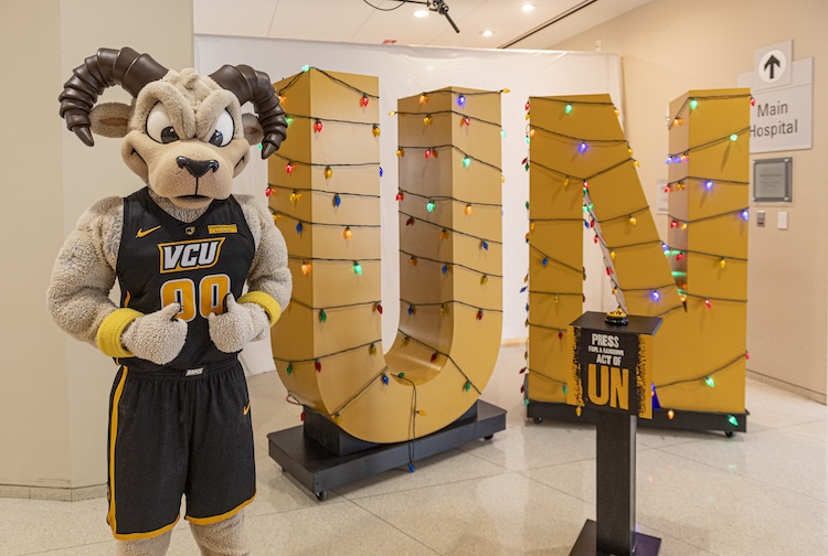 Rodney the Ram standing in front of the letters UN