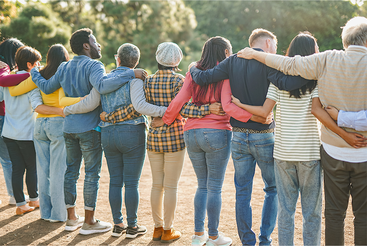 people standing in a row with arms around eachother
