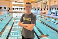 Man standing in front of swimming pool