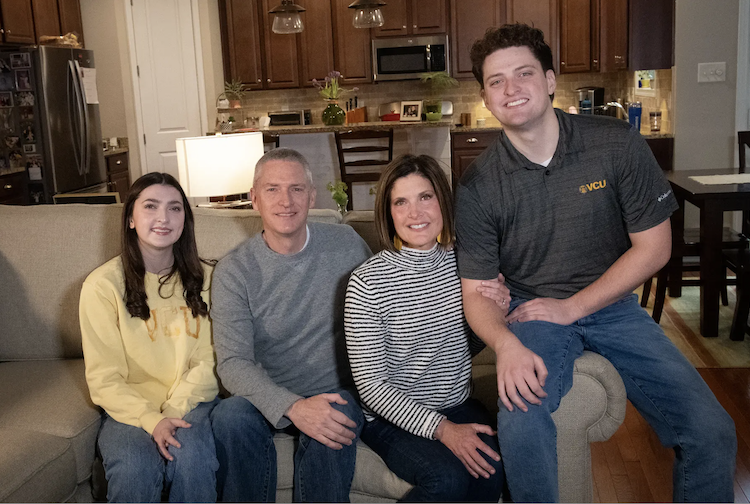 Family sitting together on couch 