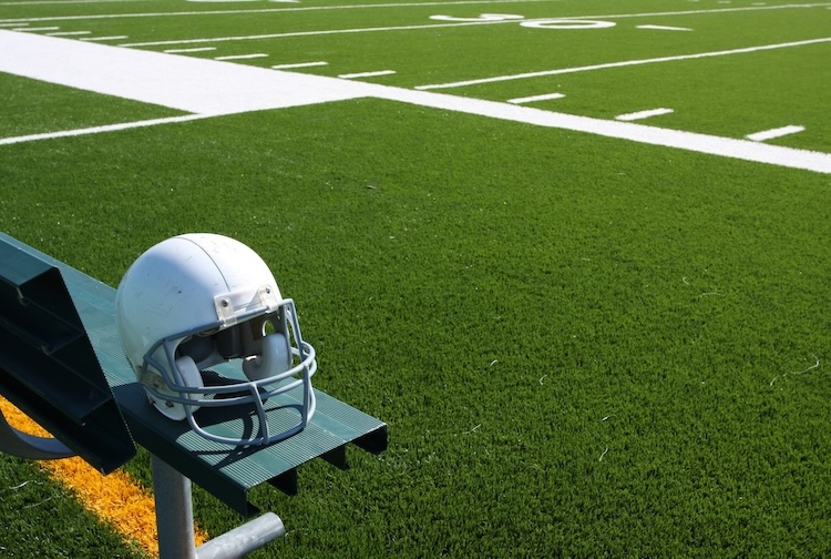football field with helmet