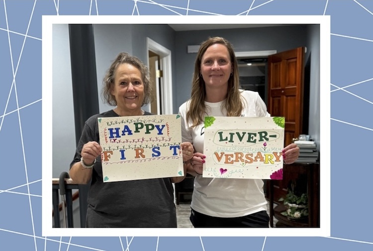 Two women hold signs up that say happy liver-versary, marking a year since their transplant