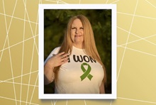  Blonde woman smiles while wearing a shirt that says ‘We won’ with the green ribbon symbolizing liver cancer awareness.