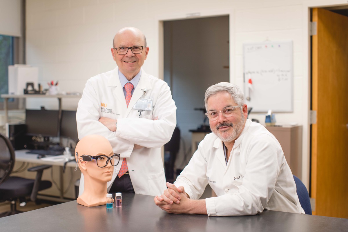Dr. Coleho and Dr. Costanzo in a lab