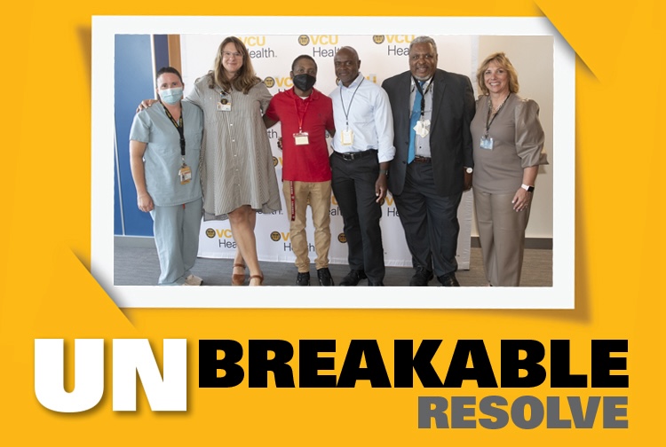 Group photo with patient and health care team. Graphic says unbreakable resolve