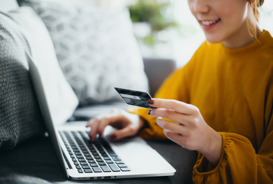 Woman with laptop and card