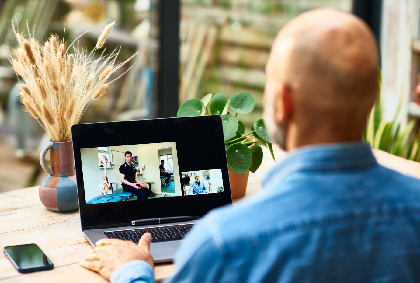 Man using laptop during video call