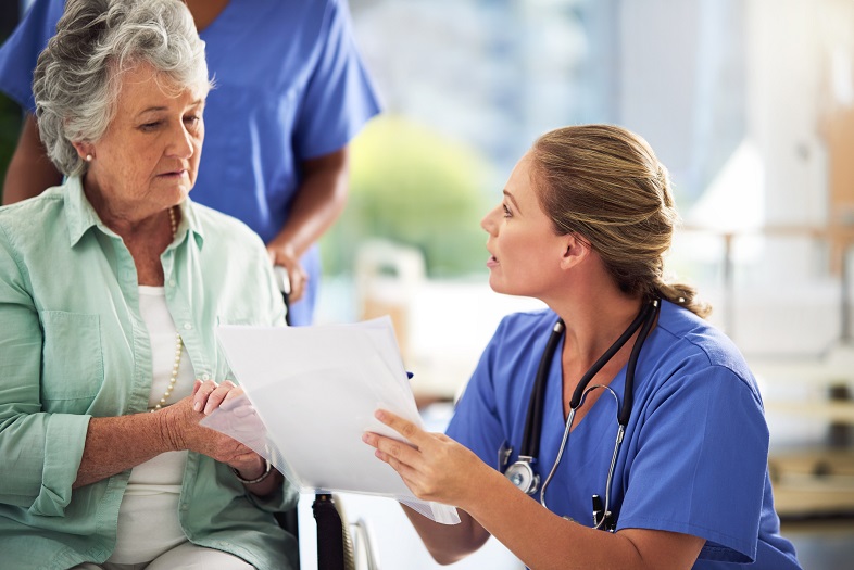 Woman talks with health care provider