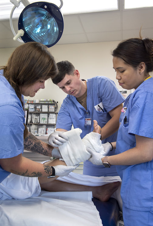 Doctors work together on foot