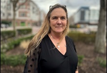 Woman stands in park