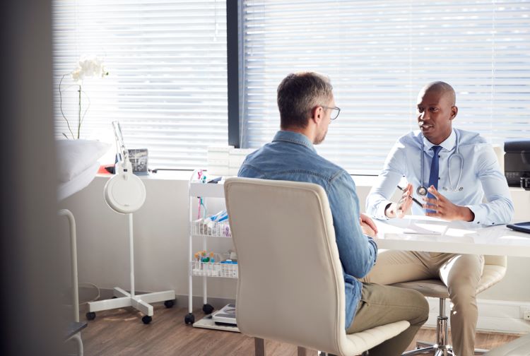 Patient talking with health care provider in a consultation