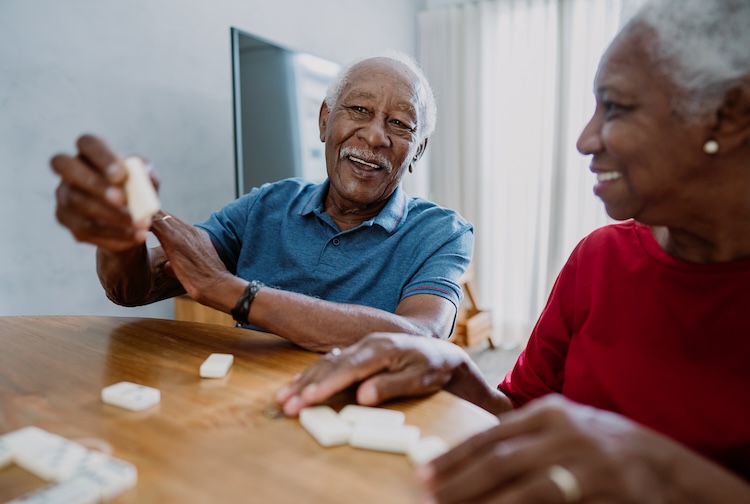 Senior couple playing dominoes