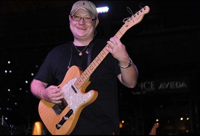 Steven Bennett with guitar, on stage
