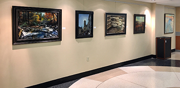 Hallway with paintings on the wall.