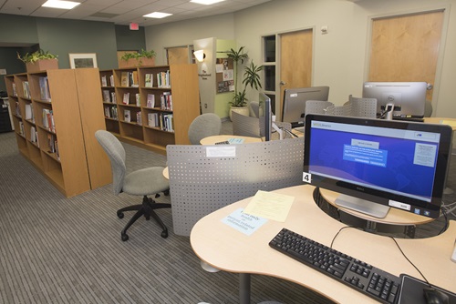 Library with bookshelves and computers.