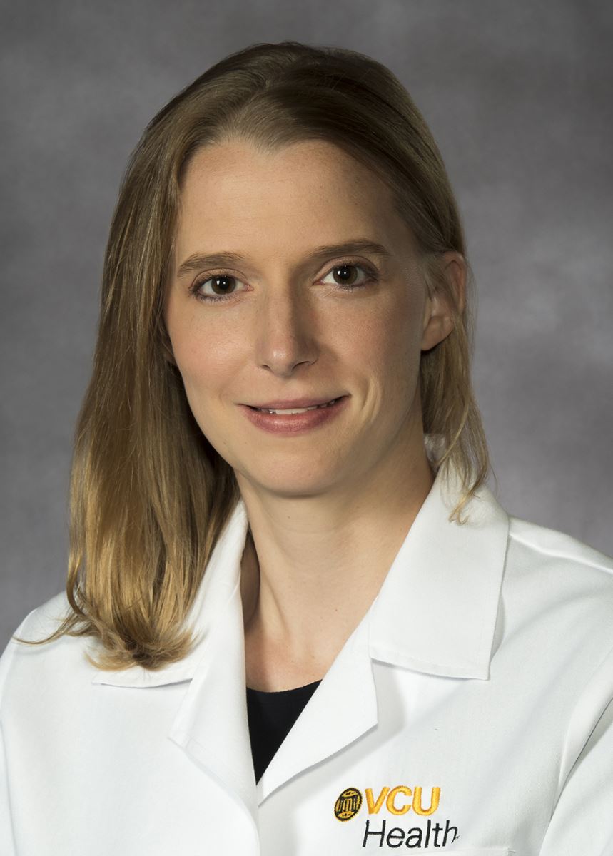 Woman in white doctor's coat.