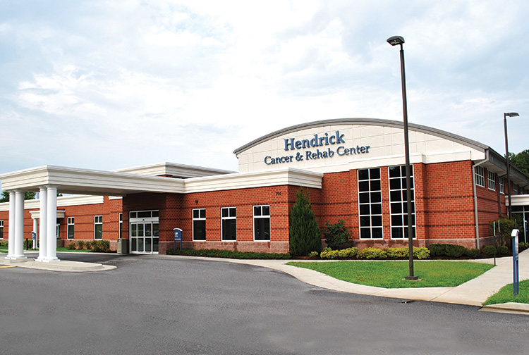 A brick building with white curved ceiling.