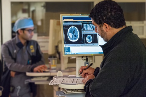 two doctors viewing brain image 