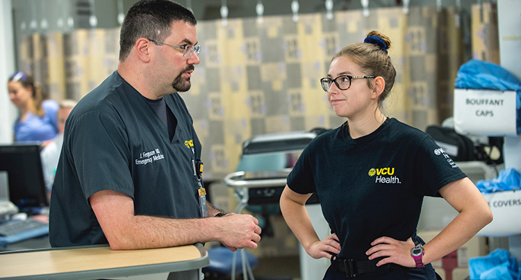 Eckert talks with Ferguson in the trauma bay