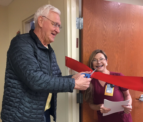 JOSEPH CHODKIEWICZ CUTTING A CEREMONIAL RIBBON